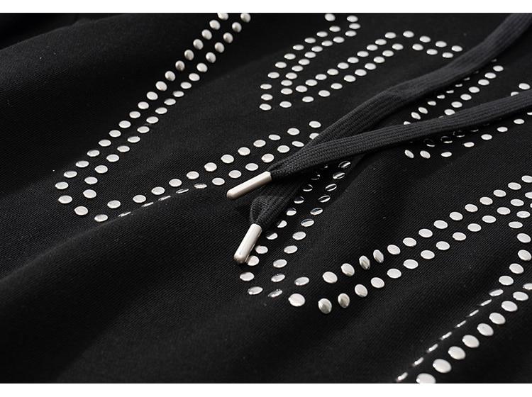 Oversized black hoodie for men featuring punk rivet details and melted letter print, perfect for autumn and winter streetwear.