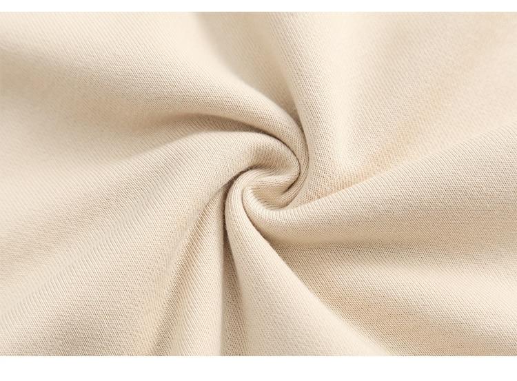 A stylish couple wearing a retro letter print patchwork color hoodie, showcasing a casual autumn streetwear look.