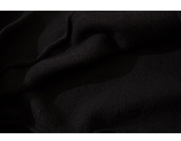 Men's hoodie featuring Harajuku letter design in black and white fleece, perfect for casual streetwear.