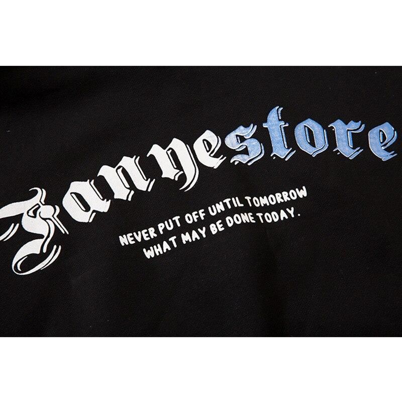 Men's hoodie featuring Harajuku letter design in black and white fleece, perfect for casual streetwear.