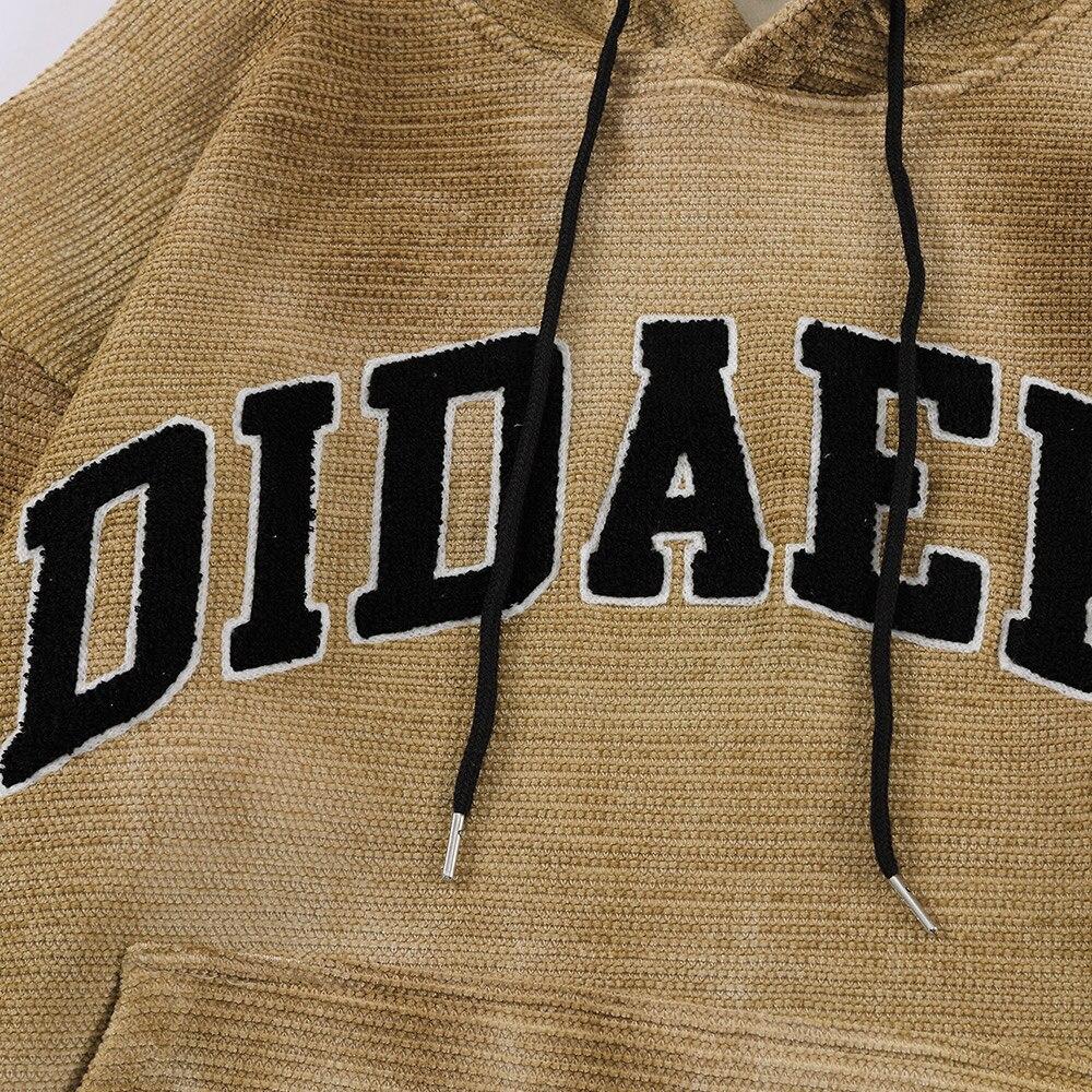 Men's tie dye hoodie with letter print, fleece material, and hooded design in gray and yellow colors.