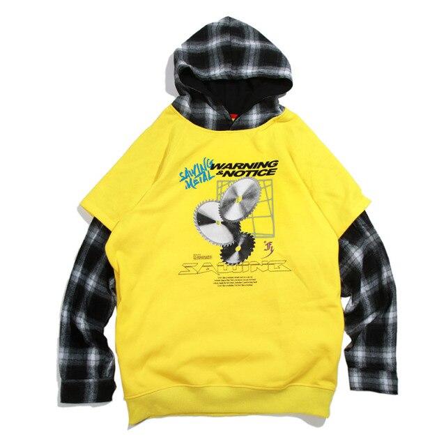 Men's oversized hooded pullover featuring plaid print sleeves in black and yellow, perfect for streetwear style.