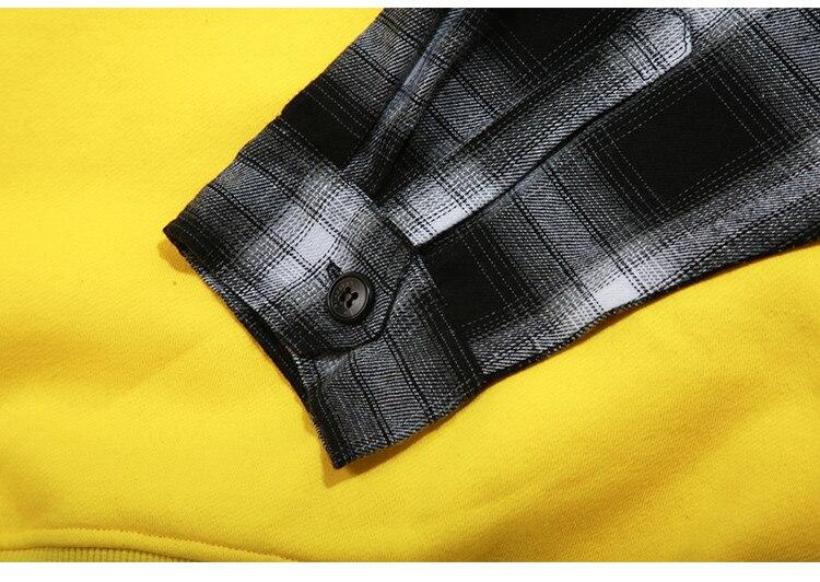 Men's oversized hooded pullover featuring plaid print sleeves in black and yellow, perfect for streetwear style.