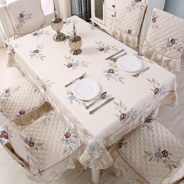 Elegant home dining table and chair non-slip cover with embroidered lace, enhancing dining aesthetics and functionality.