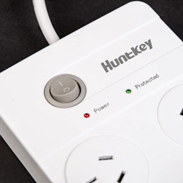Huntkey Power Board SAC604 with 6 sockets and 2 USB ports, featuring surge protection and overload safety.