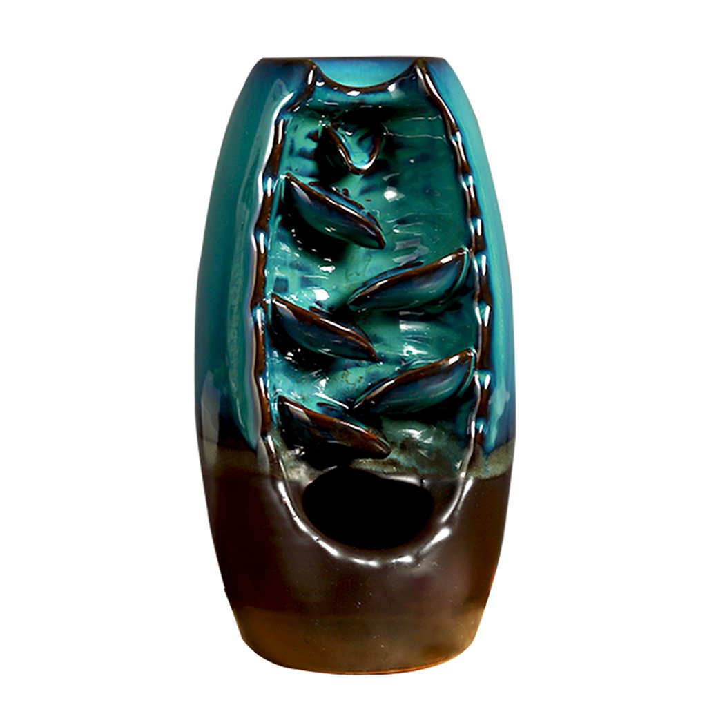 Ceramic incense burner designed like a mountain waterfall, featuring backflow smoke effect and natural incense cones.