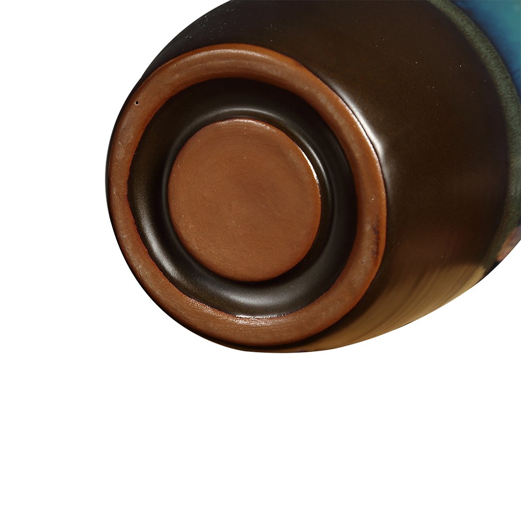 Ceramic incense burner designed like a mountain waterfall, featuring backflow smoke effect and natural incense cones.