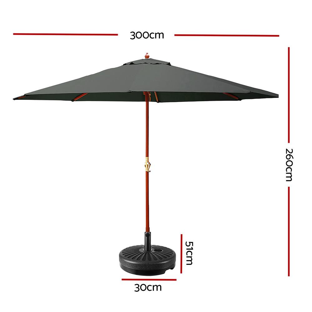 Instahut 3M Outdoor Umbrella with wooden frame and UV-resistant fabric, set up in a garden with a heavy-duty base.