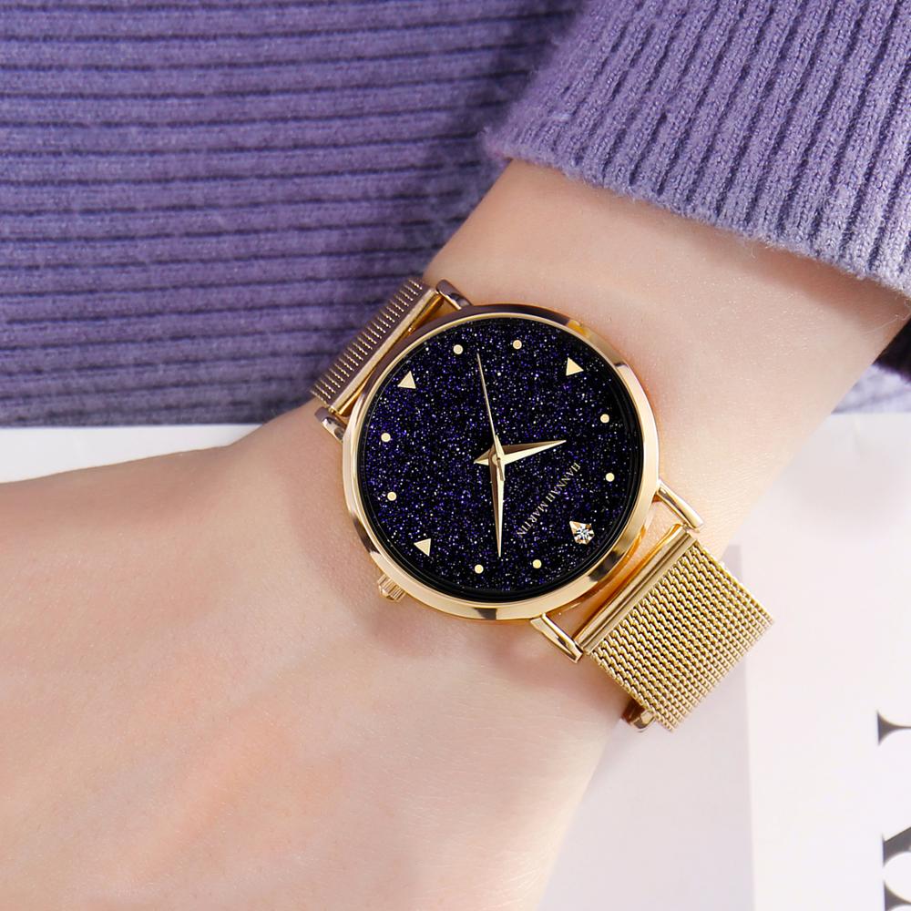 Golden ladies wristwatch featuring a stainless steel mesh band and Japan quartz movement, showcasing a stylish design with a starry night face.