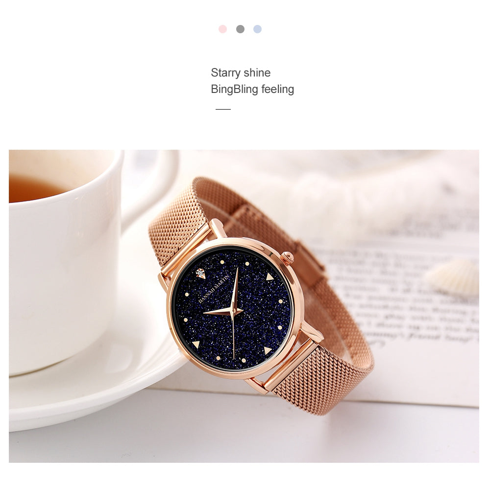 Golden ladies wristwatch featuring a stainless steel mesh band and Japan quartz movement, showcasing a stylish design with a starry night face.