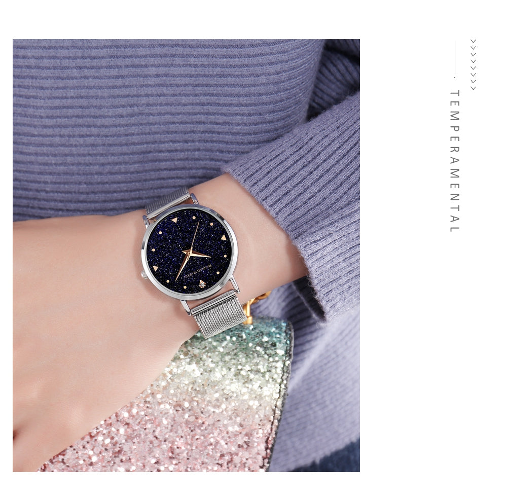 Golden ladies wristwatch featuring a stainless steel mesh band and Japan quartz movement, showcasing a stylish design with a starry night face.