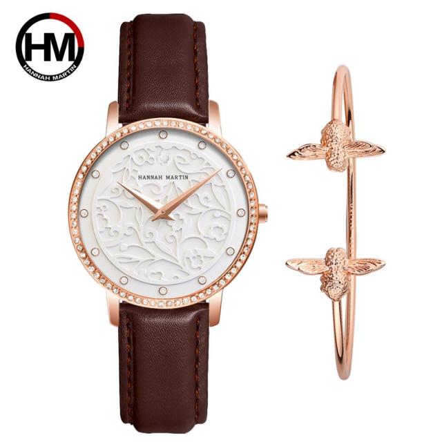 Japan Quartz Waterproof Sculpture Emboss White Flower bracelet watch for women, featuring a white flower design, stainless steel band, and elegant round case.