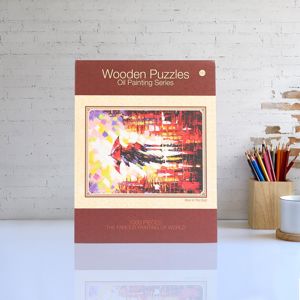 A colorful 1000-piece jigsaw puzzle made of basswood, showcasing a vibrant design with pieces scattered around, highlighting its glow-in-the-dark feature.