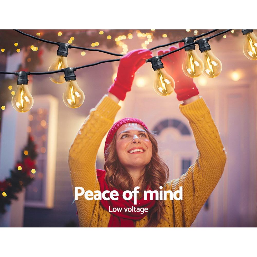 Jingle Jollys 23m LED Festoon String Lights with 20 bulbs, perfect for weddings and outdoor events, showcasing a warm glow.