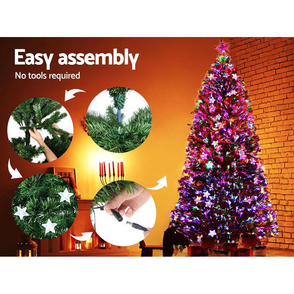 Jingle Jollys 2.4M LED Christmas Tree with optic fiber lights and a color-changing LED star on top, showcasing a lush and realistic appearance.