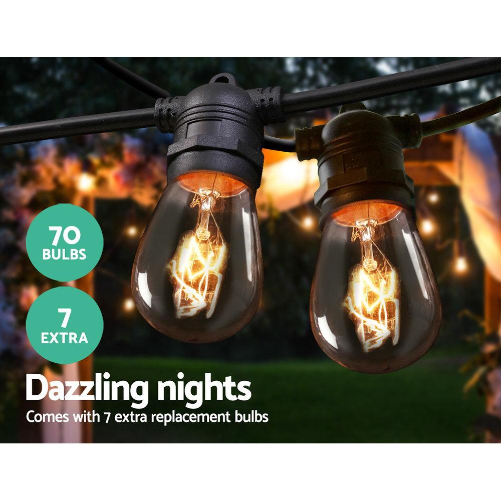 Jingle Jollys 65m Festoon String Lights with warm glowing bulbs, perfect for outdoor and indoor celebrations.