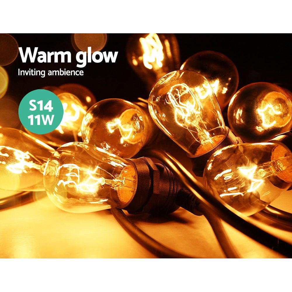 Jingle Jollys 65m Festoon String Lights with warm glowing bulbs, perfect for outdoor and indoor celebrations.