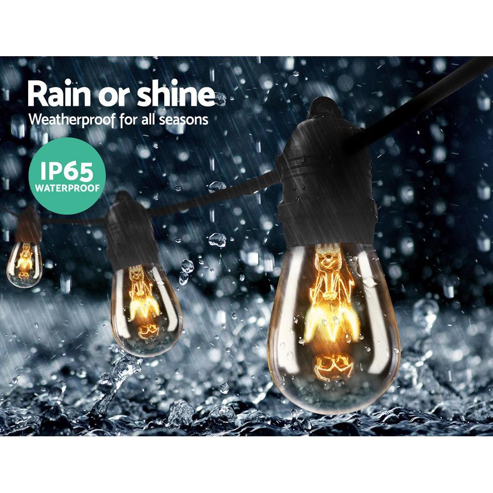 Jingle Jollys 65m Festoon String Lights with warm glowing bulbs, perfect for outdoor and indoor celebrations.