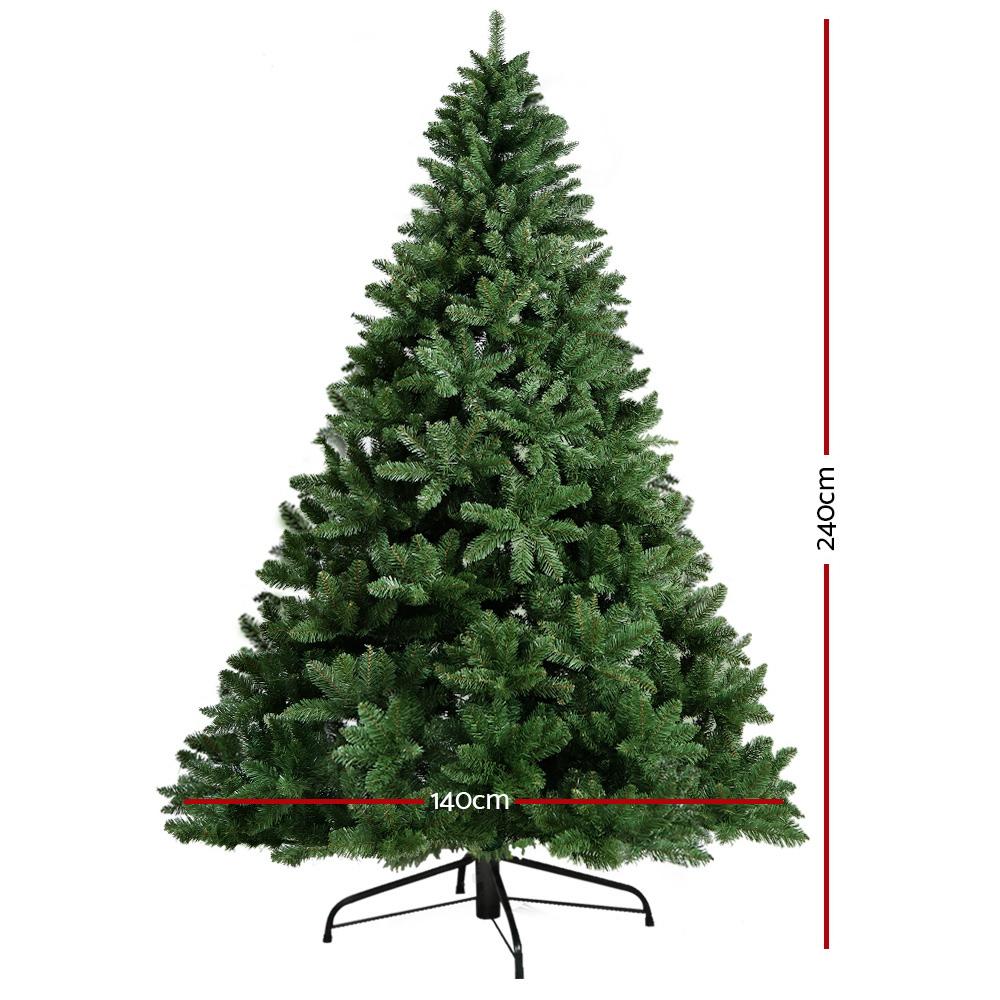 Jingle Jollys 8FT Green Christmas Tree with realistic PVC tips and sturdy metal stand, beautifully decorated for the holiday season.