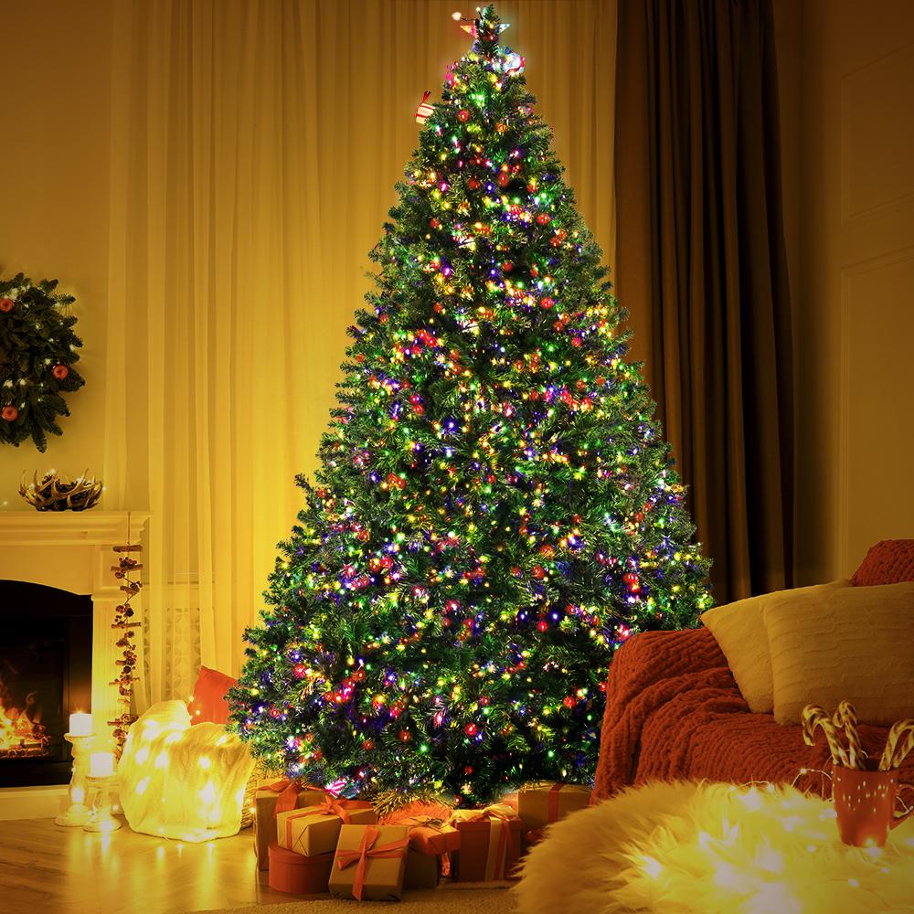 Jingle Jollys 2.4M LED Christmas Tree with multicoloured lights and a sturdy metal stand, beautifully decorated for the festive season.