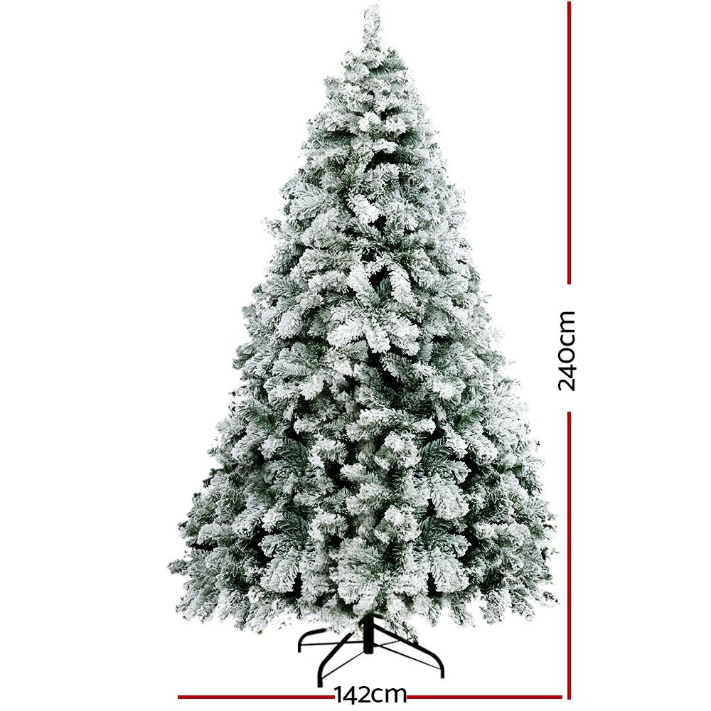 Jingle Jollys Snowy Christmas Tree standing 2.4m tall with snow-sprayed tips, showcasing a lush and realistic appearance.