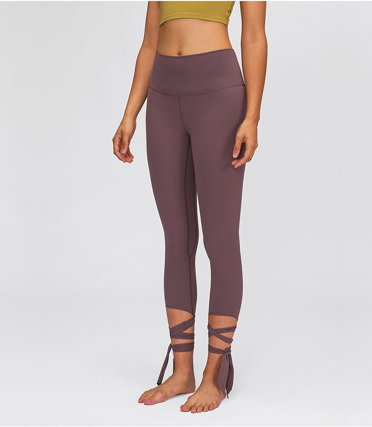 JUST A TIE Naked Feel Yoga Dancer Capri Pants for women, featuring 4-way stretch, inner pocket, and calf-length design in a stylish athletic look.
