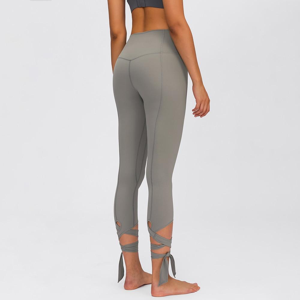 JUST A TIE Naked Feel Yoga Dancer Capri Pants for women, featuring 4-way stretch, inner pocket, and calf-length design in a stylish athletic look.