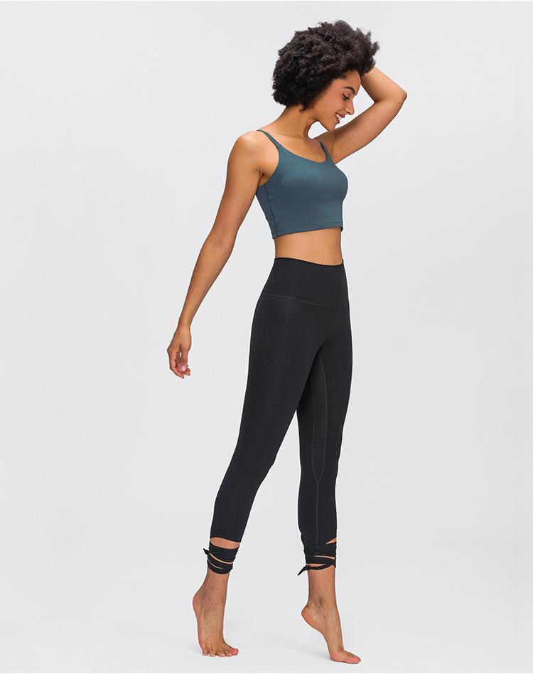 JUST A TIE Naked Feel Yoga Dancer Capri Pants for women, featuring 4-way stretch, inner pocket, and calf-length design in a stylish athletic look.