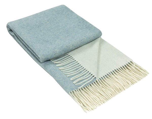 Kensington Throw blanket made of 10% cashmere and 90% superfine merino wool, elegantly draped on a cozy sofa.