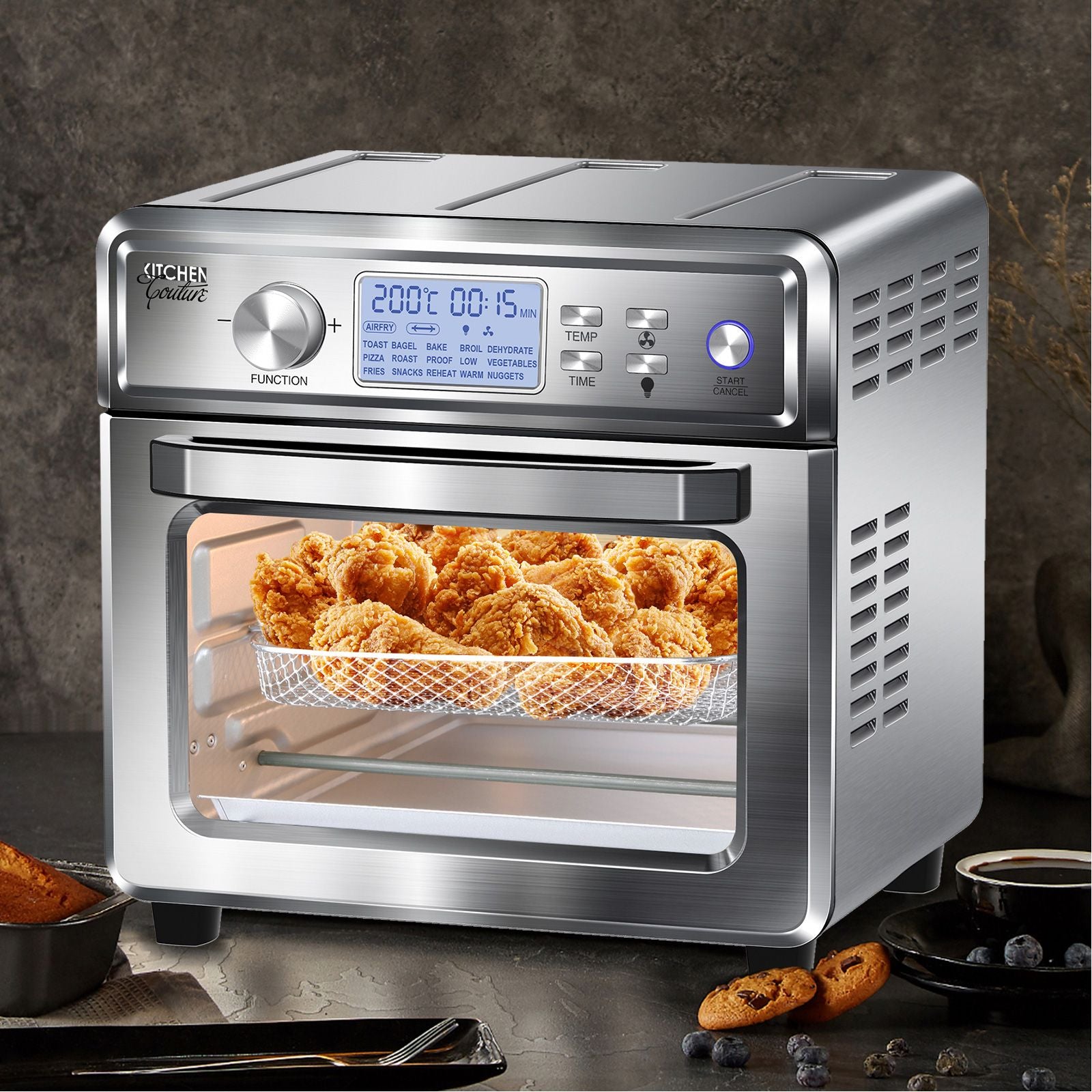 Kitchen Couture 24 Litre Air Fryer with LCD display and stainless steel design, showcasing its large capacity and included accessories.