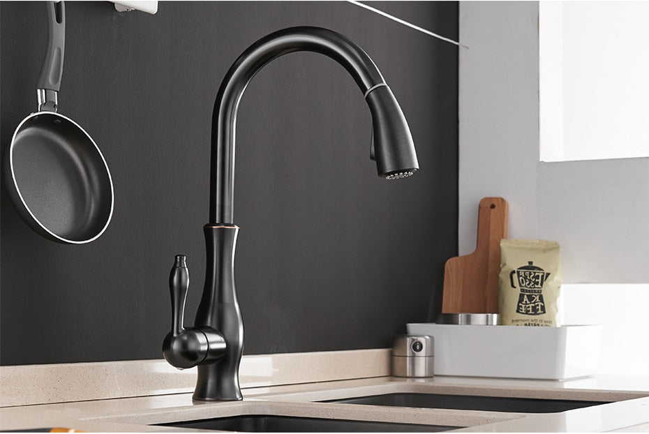 Black single handle pull out kitchen faucet with 360-degree swivel and brass construction, designed for modern kitchens.