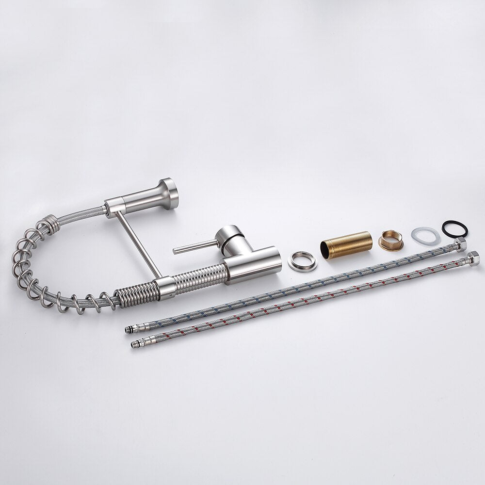 Brushed nickel kitchen faucet with pull-down spray head, showcasing a sleek and modern design suitable for any kitchen decor.