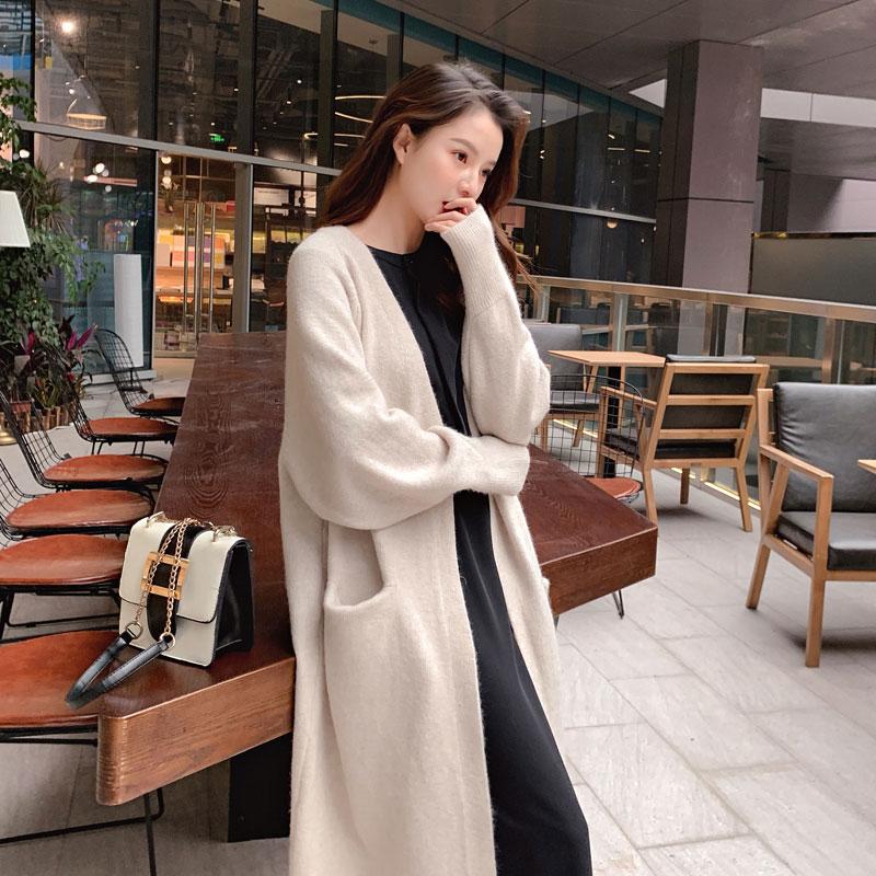 A stylish Lazy V-neck Oversize Long Sweater Cardigan in a solid color, featuring a relaxed fit and pockets, perfect for casual wear.