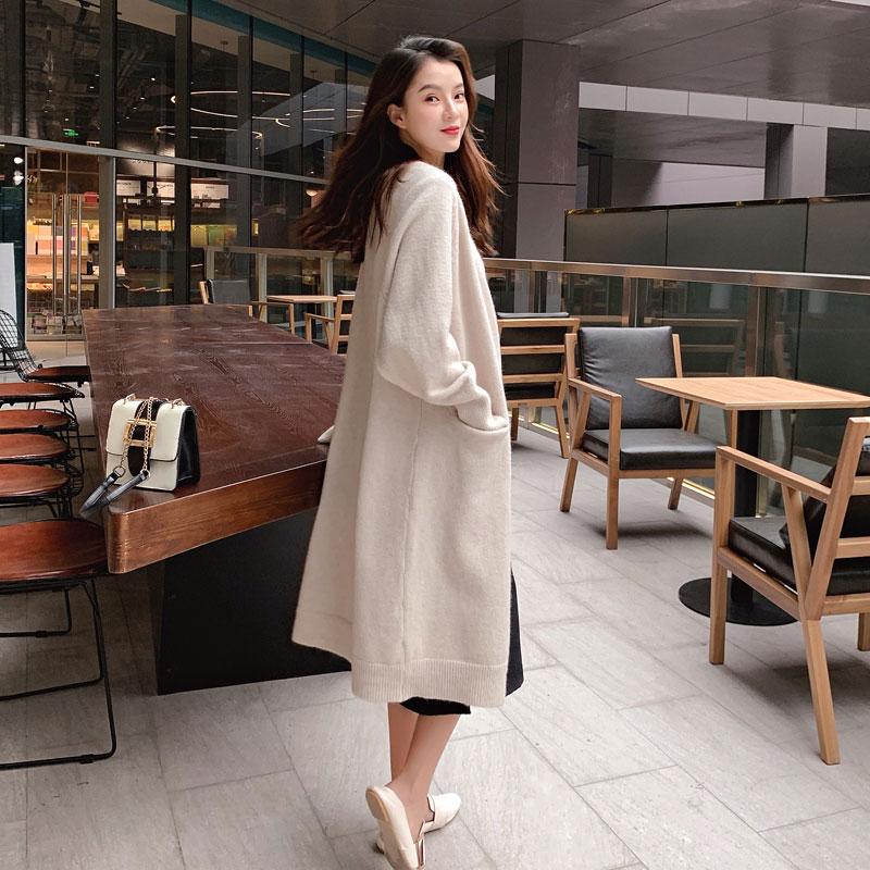 A stylish Lazy V-neck Oversize Long Sweater Cardigan in a solid color, featuring a relaxed fit and pockets, perfect for casual wear.