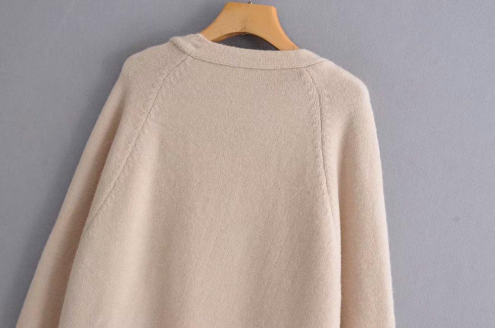 A stylish Lazy V-neck Oversize Long Sweater Cardigan in a solid color, featuring a relaxed fit and pockets, perfect for casual wear.