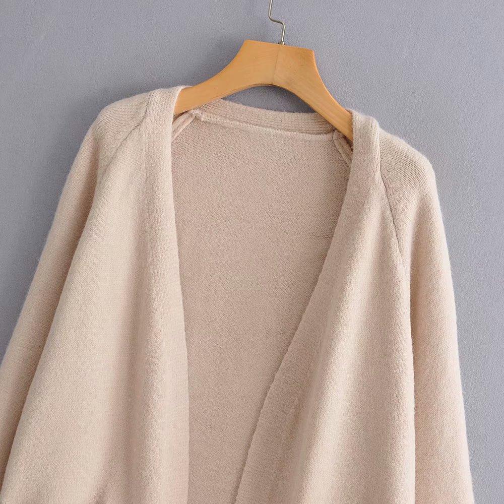 A stylish Lazy V-neck Oversize Long Sweater Cardigan in a solid color, featuring a relaxed fit and pockets, perfect for casual wear.
