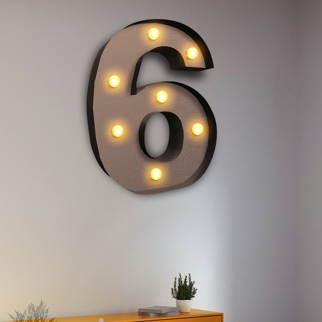 LED Metal Number Lights displayed in a festive setting, showcasing their warm glow and personalized message options for events.