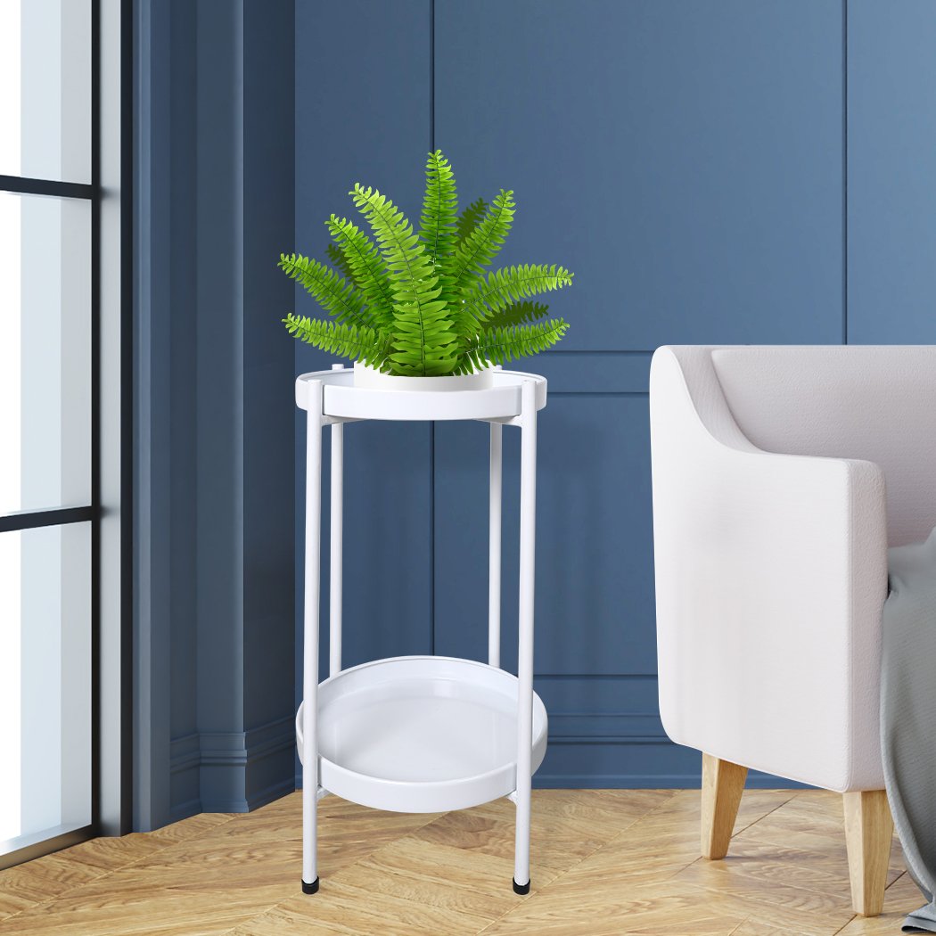 Levede 2 Tiers Plant Stand showcasing multiple flower pots in a garden setting, featuring a sleek white metal design.