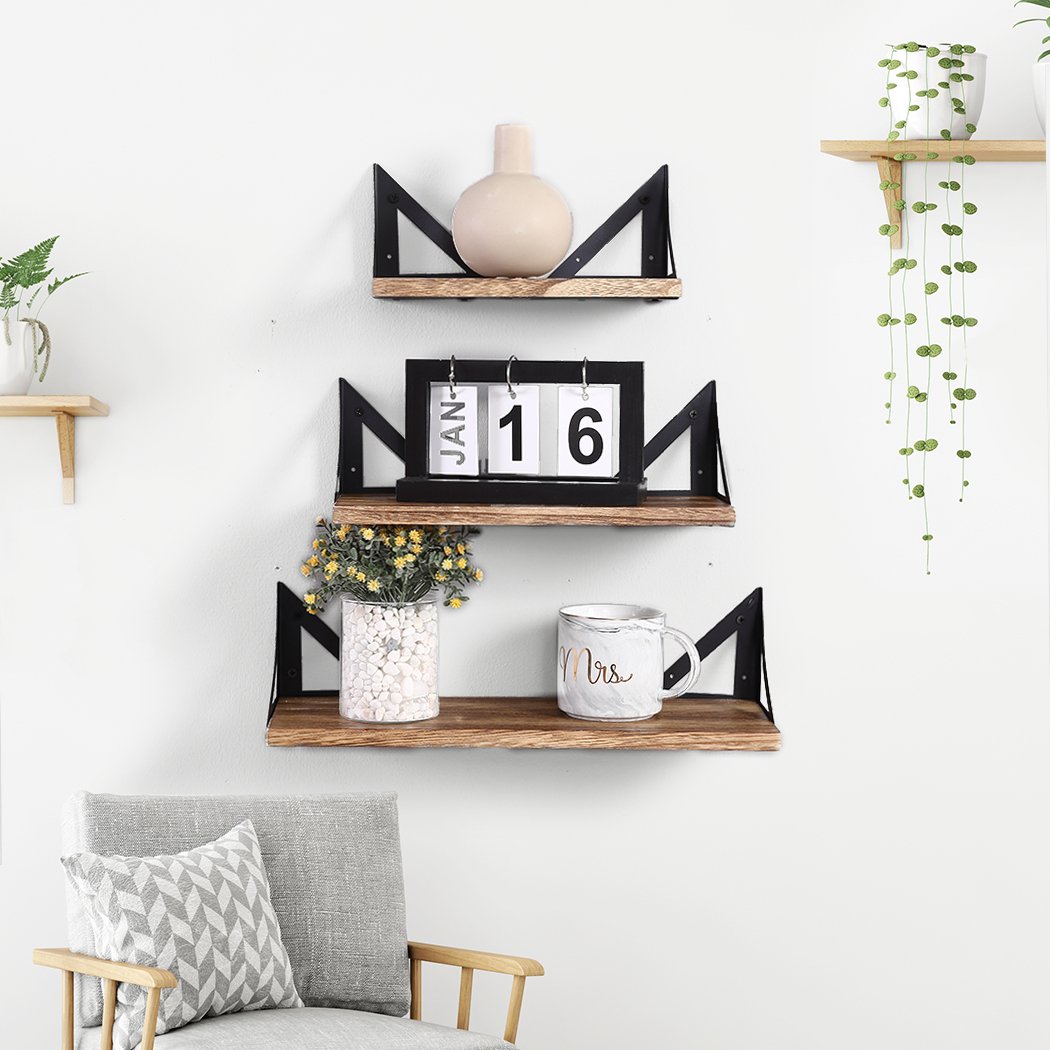 Levede Floating Shelf Brackets showcasing three wooden shelves mounted on a wall, featuring a rustic and industrial design.