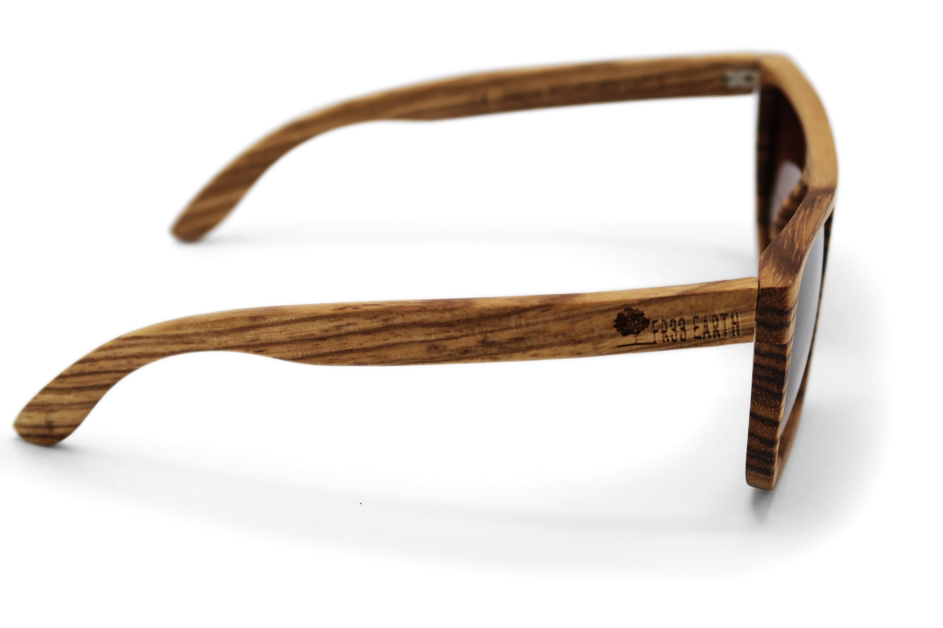 Lizards Brown Sunglasses featuring a stylish wooden frame and polarized lenses, packaged in a reusable wood box with accessories.