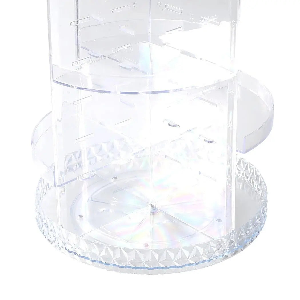 A clear acrylic rotating cosmetic organizer with a diamond shape design, featuring three tiers for makeup storage.