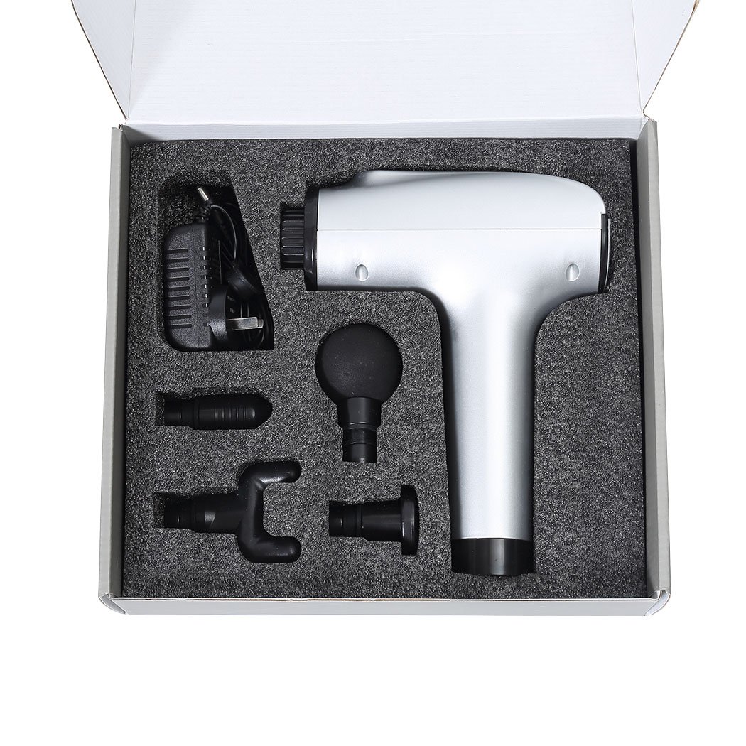 A sleek silver massage gun with four interchangeable heads, designed for deep tissue percussion massage and muscle relaxation.