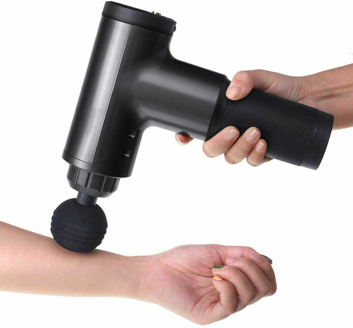 Massage Gun Percussion Massager with four interchangeable heads for deep tissue muscle relaxation.
