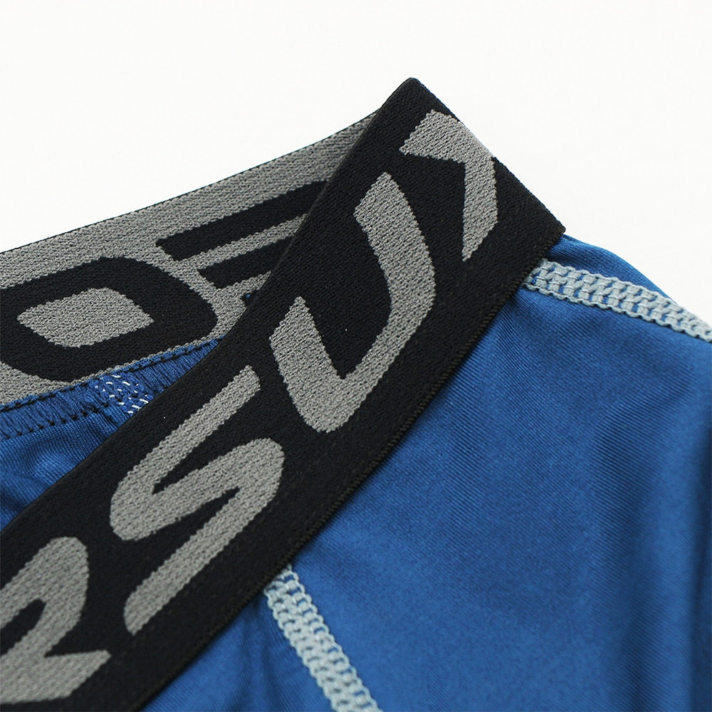 ARSUXEO Men's 3/4 Sports Compression Tights in solid black, showcasing the sleek design and high-quality fabric suitable for running and gym workouts.