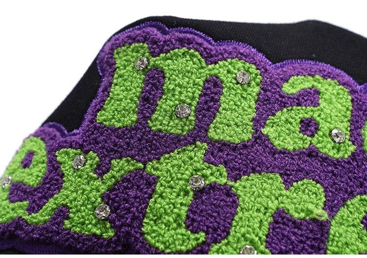 Men's hooded sweatshirt featuring colorful letter patches and diamond accents, with a large front pocket, perfect for casual streetwear.