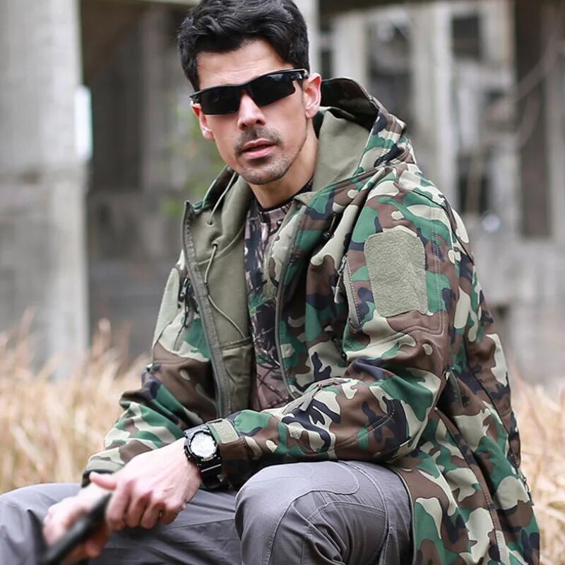 Men's military tactical hiking jacket in camouflage design, featuring windproof and waterproof capabilities, perfect for outdoor adventures.