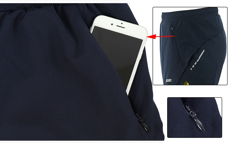 Men's 2 in 1 running shorts featuring quick-dry fabric, zipper pockets, and a stylish patchwork design, ideal for active training.