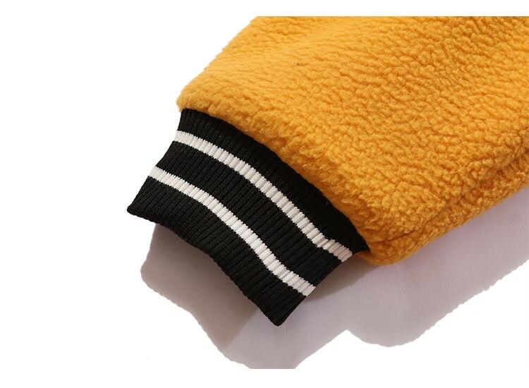 Men's winter jacket featuring color block patchwork and embroidery, designed for warmth and style.