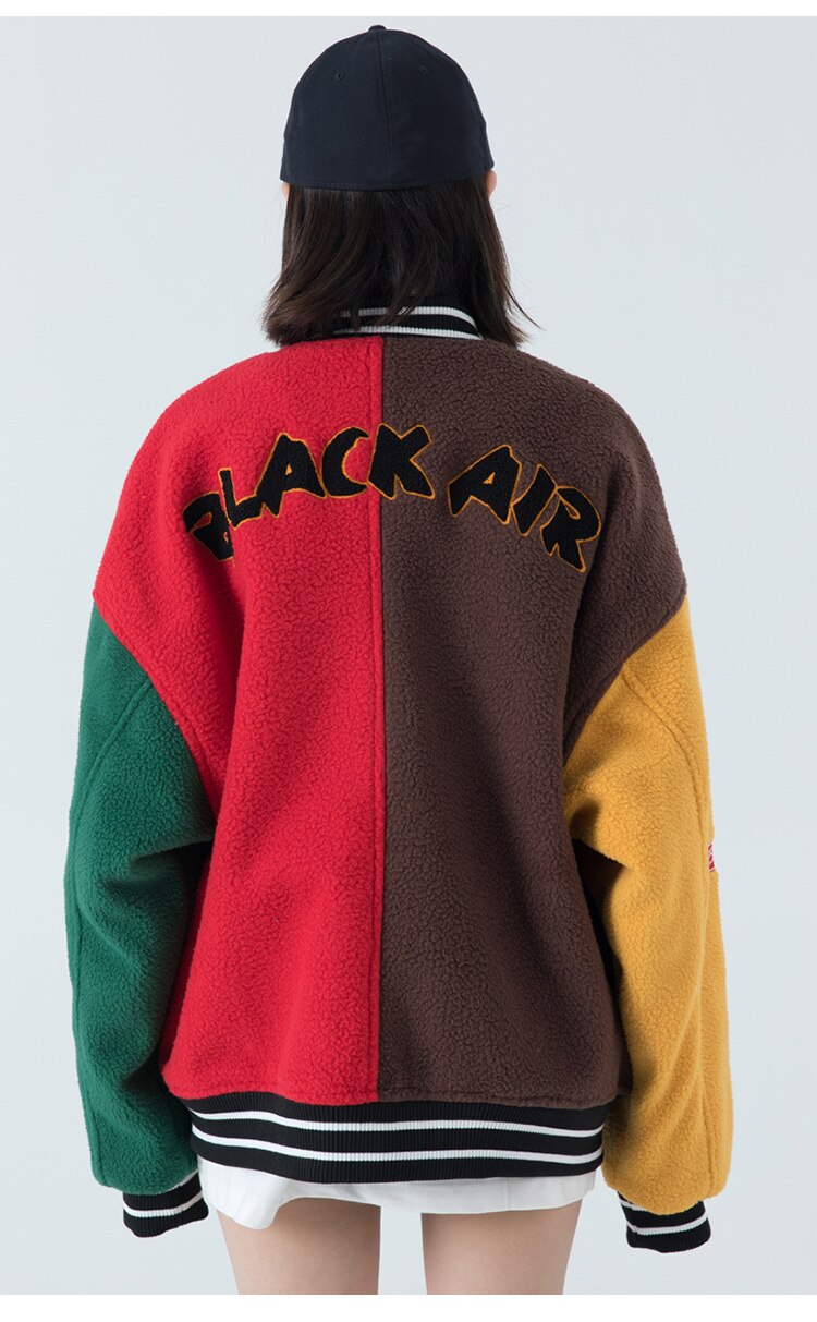 Men's winter jacket featuring color block patchwork and embroidery, designed for warmth and style.