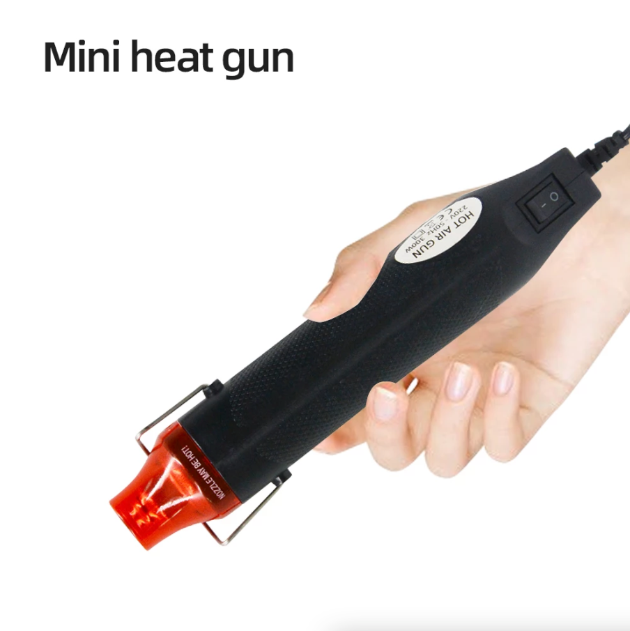 Mini Heat Gun DIY Electric Nozzles Tool with ergonomic design and stainless steel stand for easy crafting and embossing.